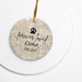 Round ceramic ornament with paw print and text 'forever loved Luna 2010-2025' on a gold background