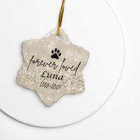 Decorative pet memorial ornament with 'forever loved Luna' text on a gold background