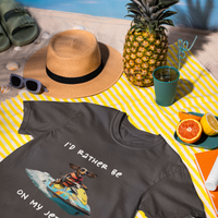 Dark gray unisex organic cotton t-shirt with dachshund on a jetski graphic "I'd rather be on my jetski"